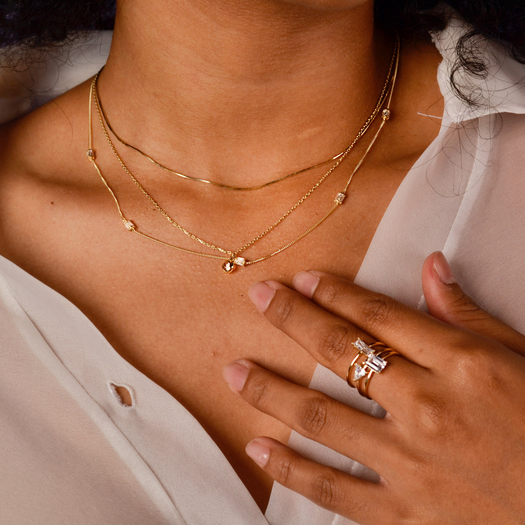 Baguette Stacker Ring 14k gold stacked on model finger – Foundry