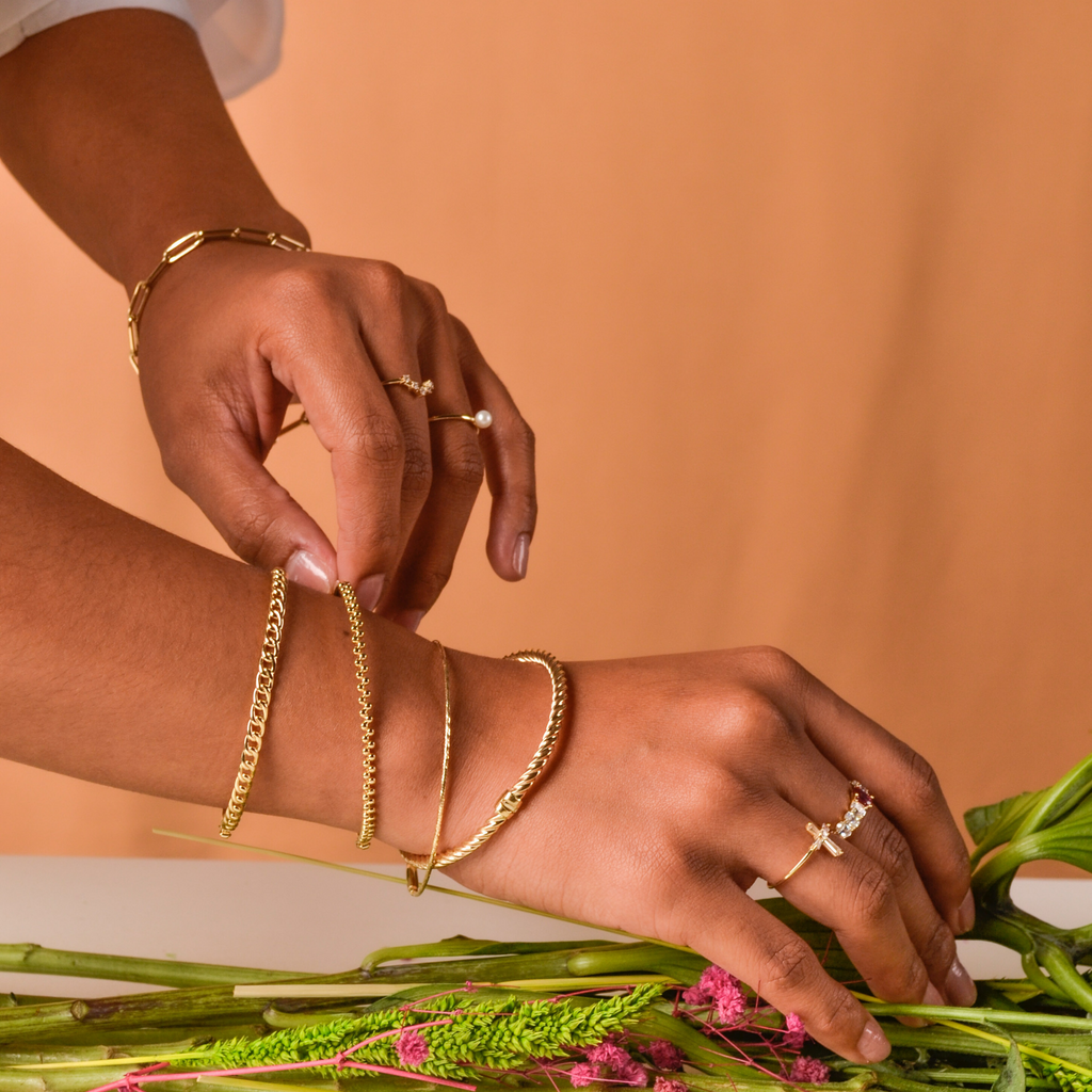 Chain Bangle 14k gold stacked with bangles on model wrist – Foundry