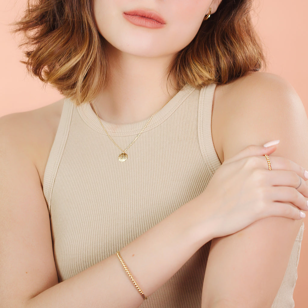 Beads Bold Bangle 14k gold stacked on model wrist – Foundry