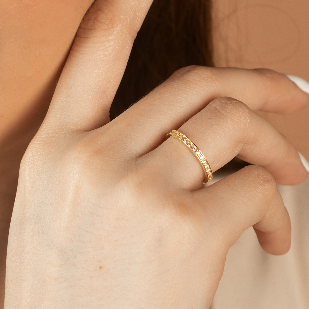 Essential Eternity Ring 14k gold stacked on model finger– Foundry
