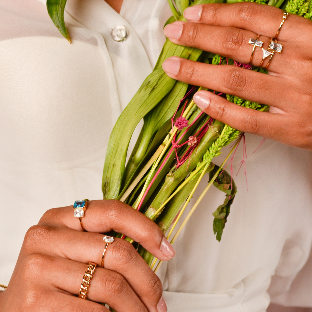 Mini Oval Ring 14k gold stacked on model finger – Foundry
