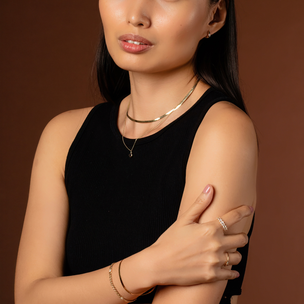 Oval Cut Half Eternity 14k gold stacked on model finger – Foundry