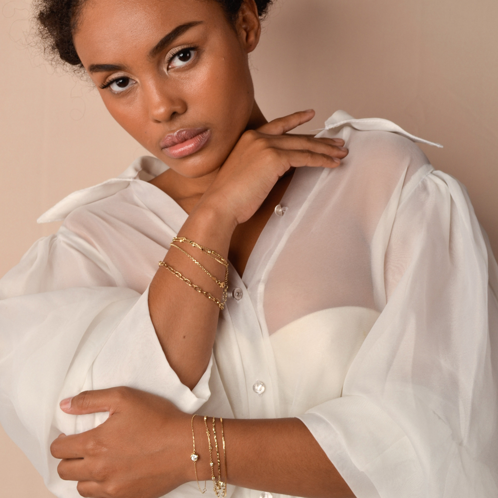 Cable Chain Bracelet 14k gold stacked on model wrist – Foundry