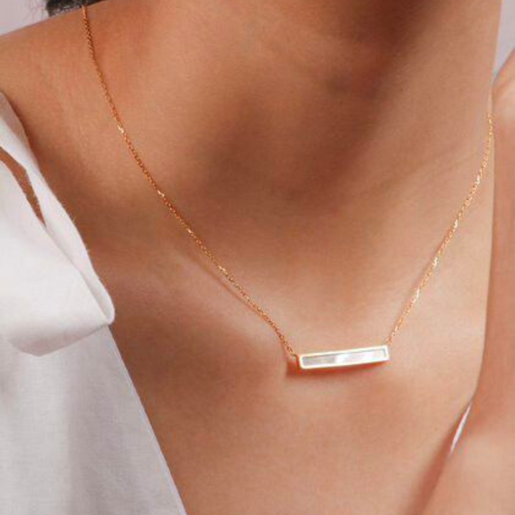 Mother of Pearl Bar Necklace 14k gold stacked on model neck – Foundry