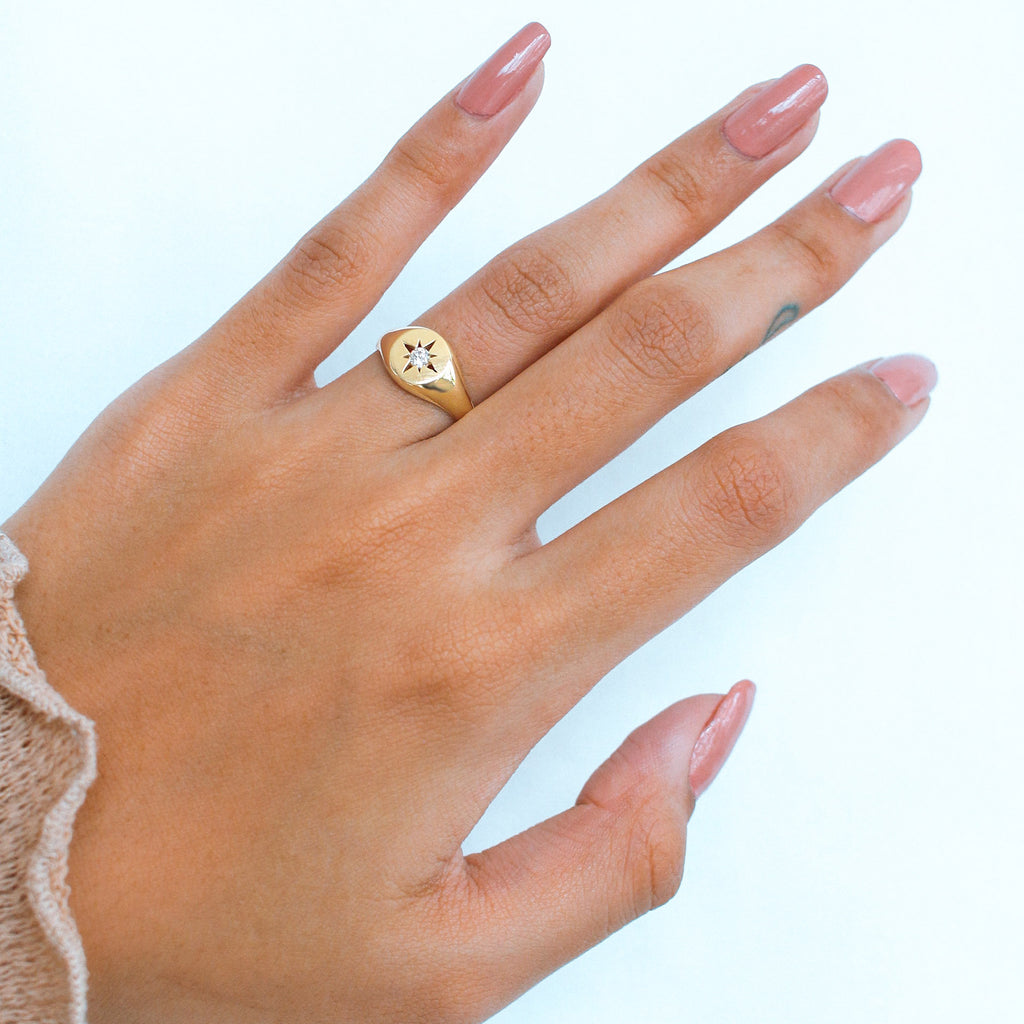 Nothstar Signet Ring 18k gold stacked on model finger – Foundry