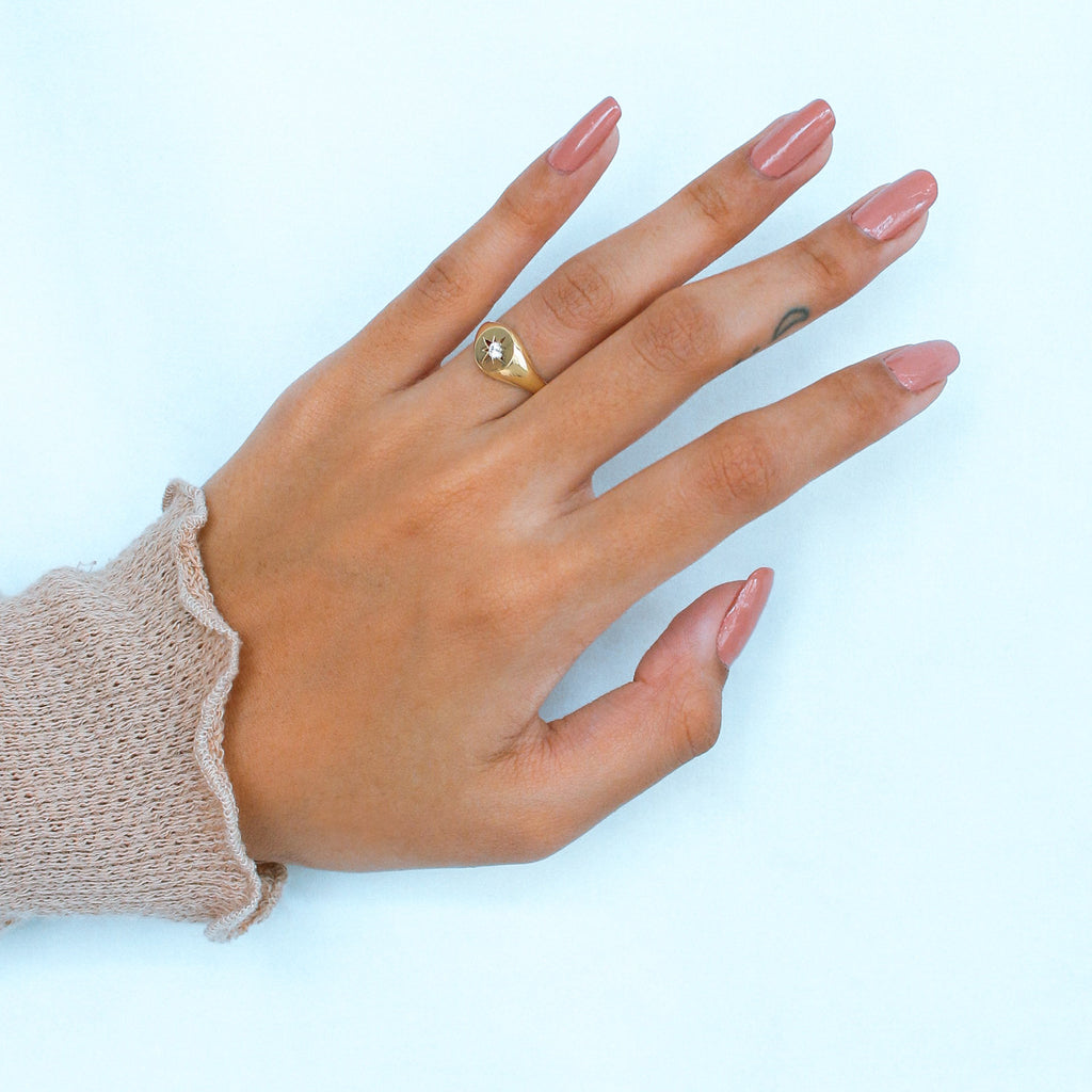 Nothstar Signet Ring 18k gold stacked on model finger – Foundry