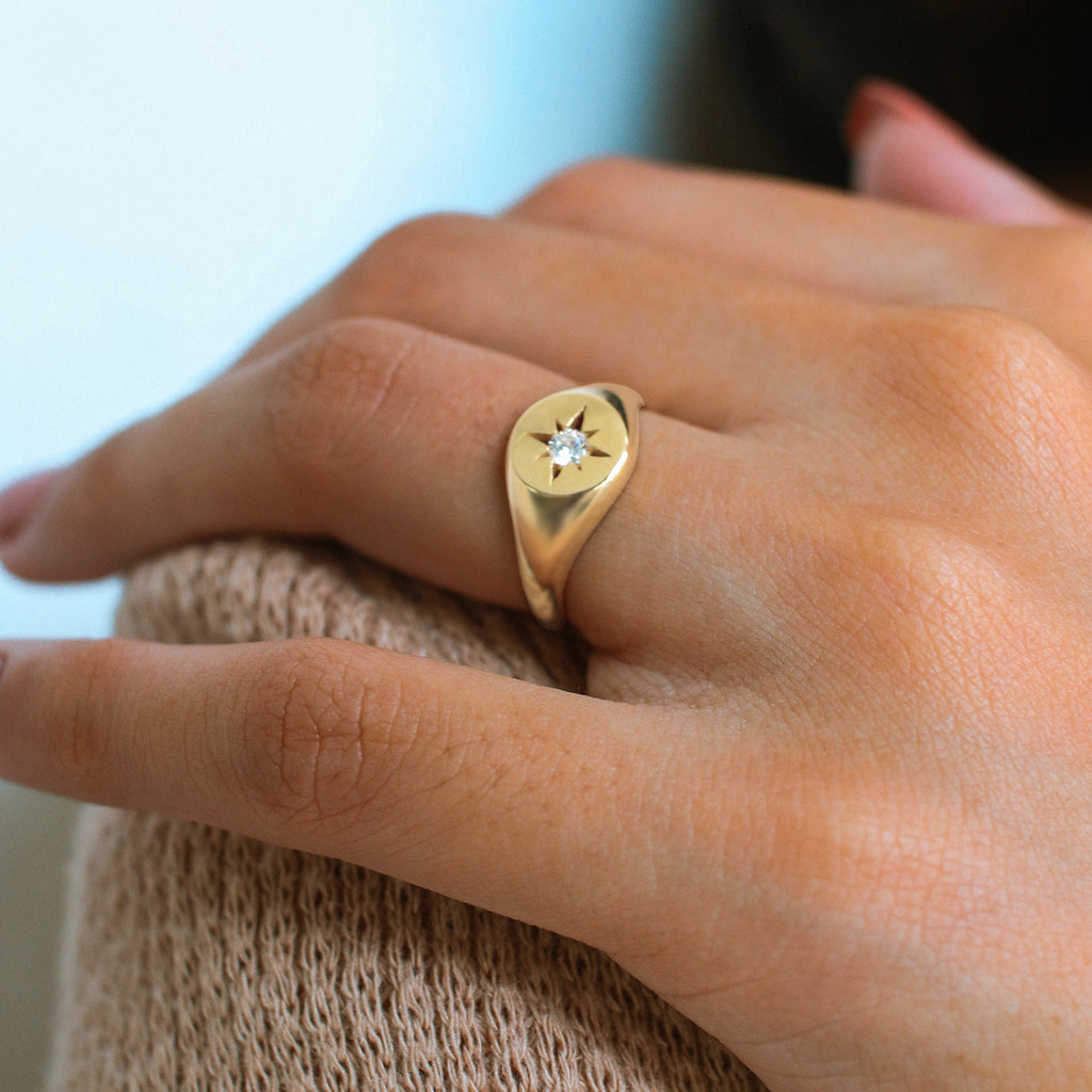 Nothstar Signet Ring 18k gold stacked on model finger – Foundry