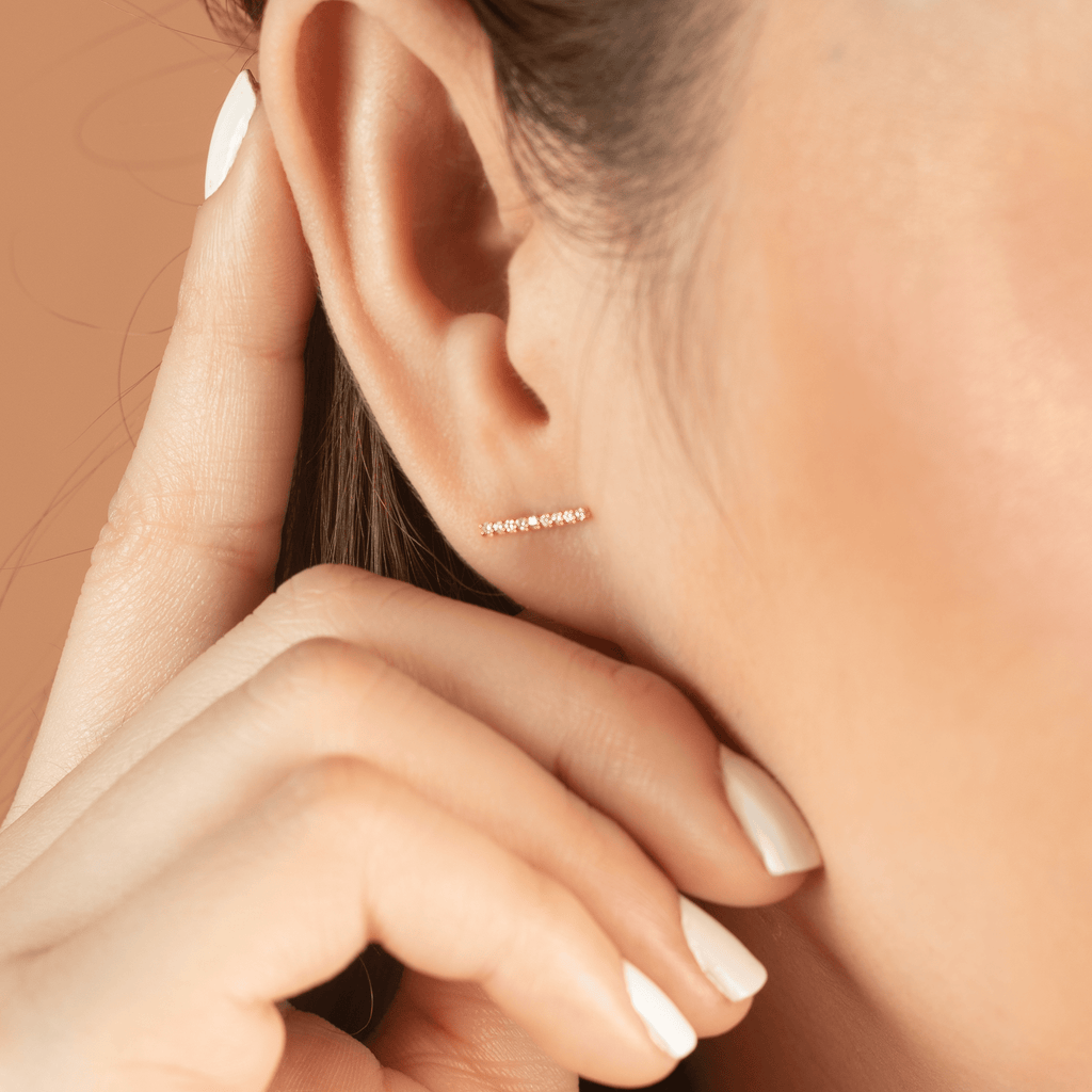 Pave Diamond Long bar Studs 14k gold stacked on model ears – Foundry