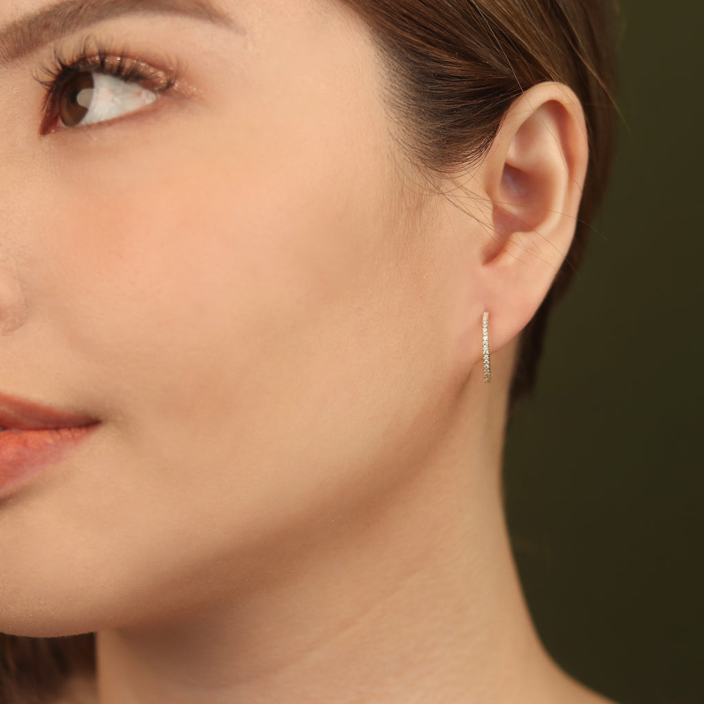 Pave Diamond Midi Hoops 14k gold stacked on model ears – Foundry