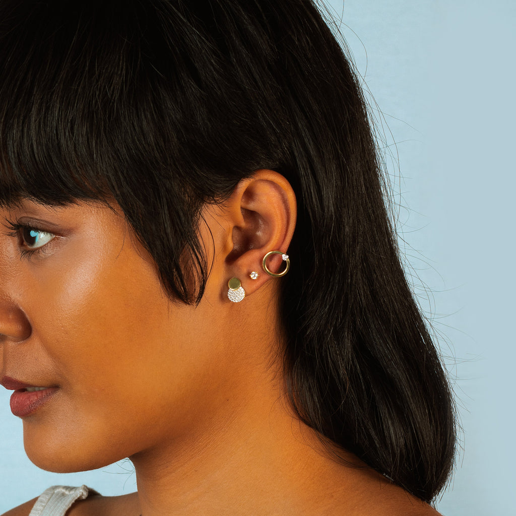Pave Dots Studs 18k gold stacked on model ear– Foundry