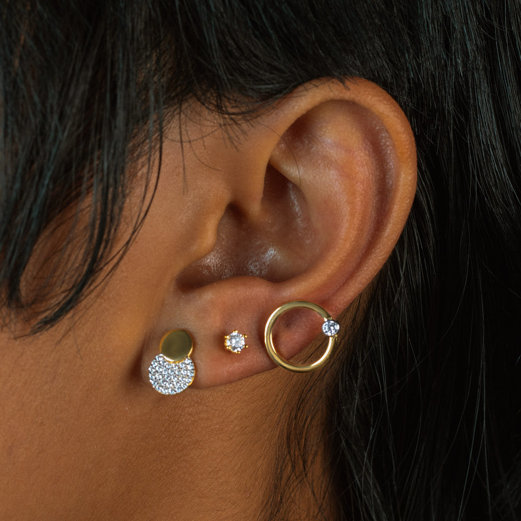 Pave Dots Studs 18k gold stacked on model ear– Foundry