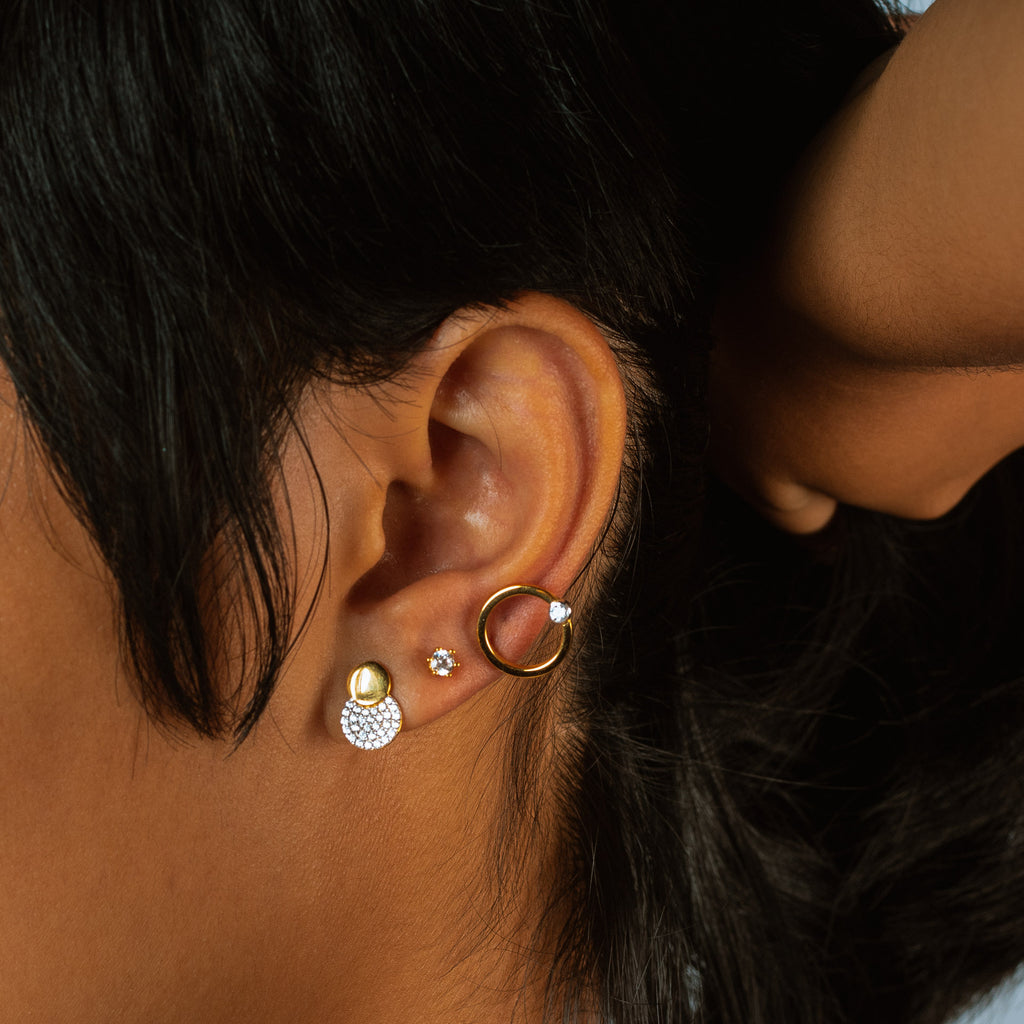 Pave Dots Studs 18k gold stacked on model ear– Foundry