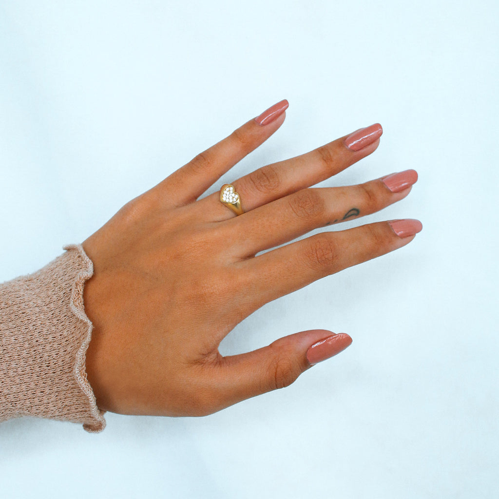 Pave Heart Signet Ring 18k gold stacked on model finger – Foundry