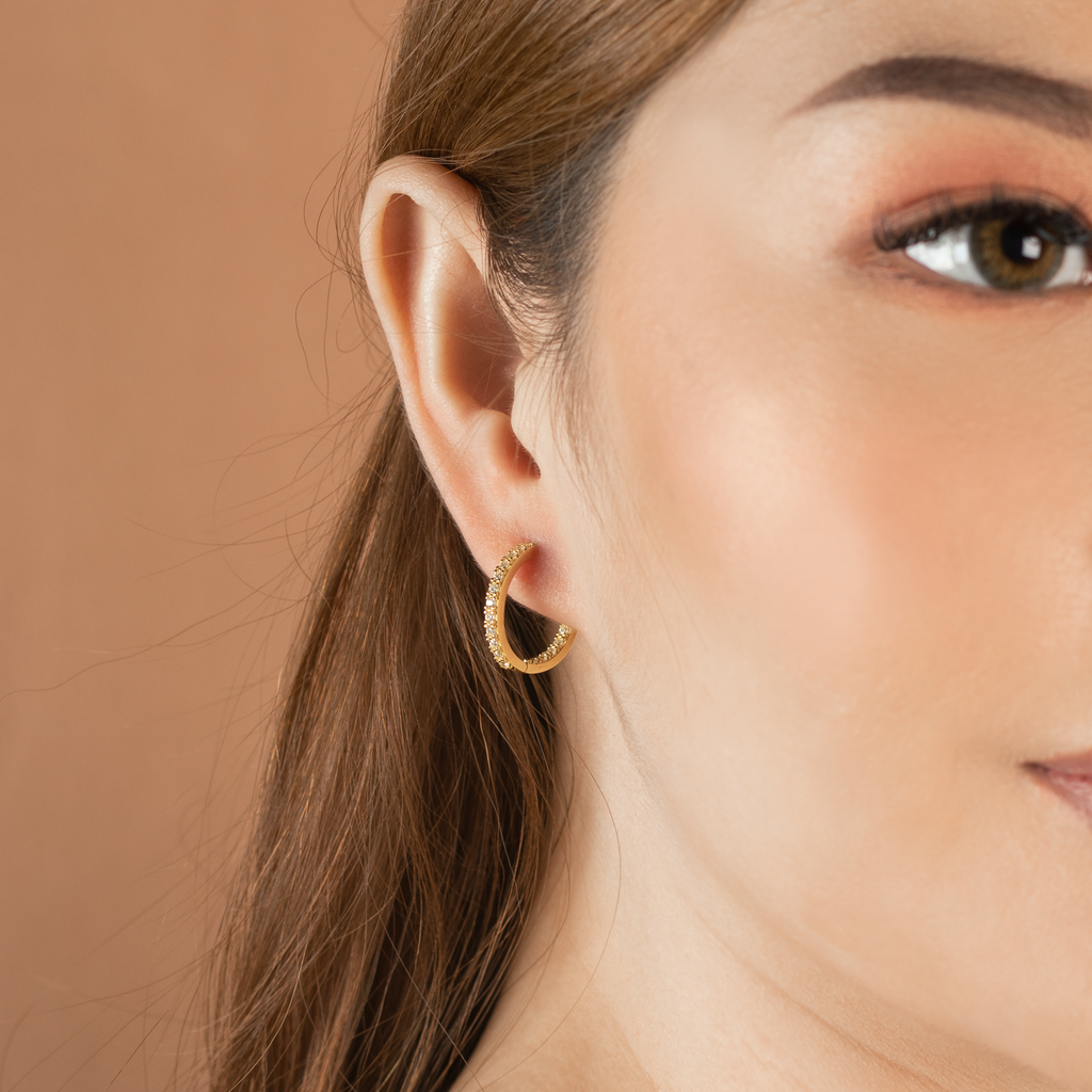Pave Inside Out Hoops 18k gold stacked on model ears – Foundry