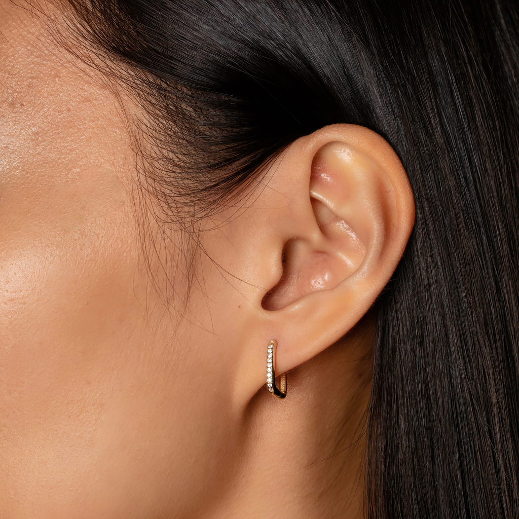 Pave Square Hoops 14k gold stacked on model ear – Foundry