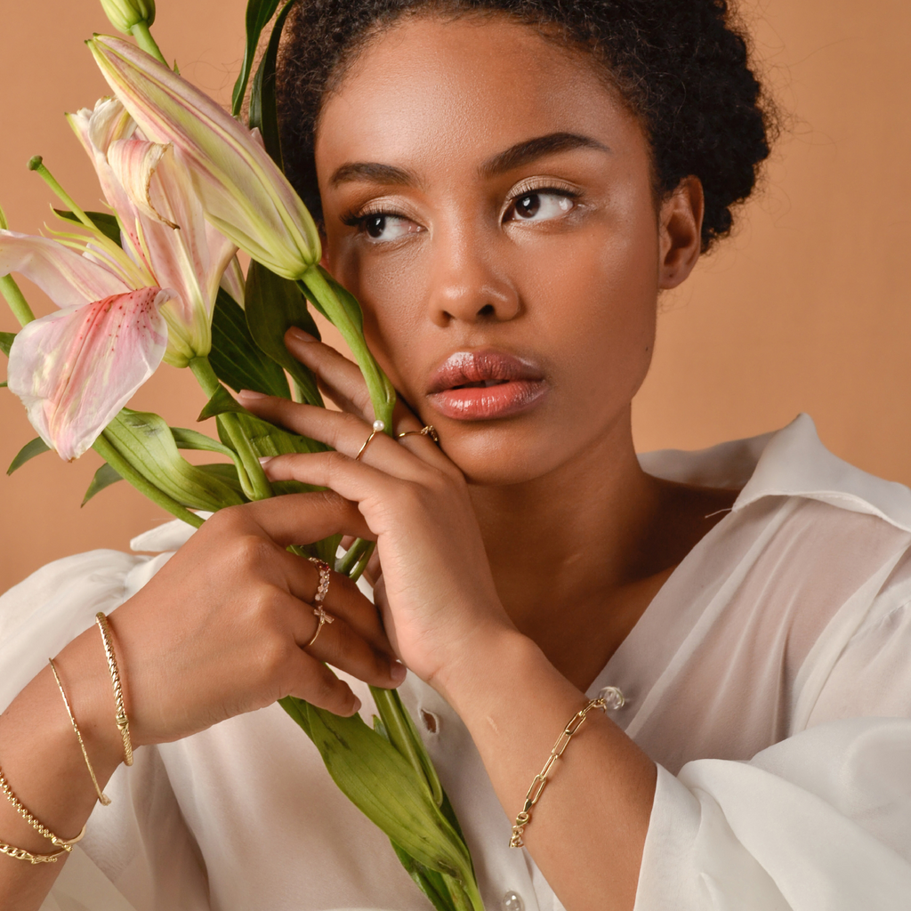 Pearl Stacker Ring 14k gold stacked on model finger – Foundry