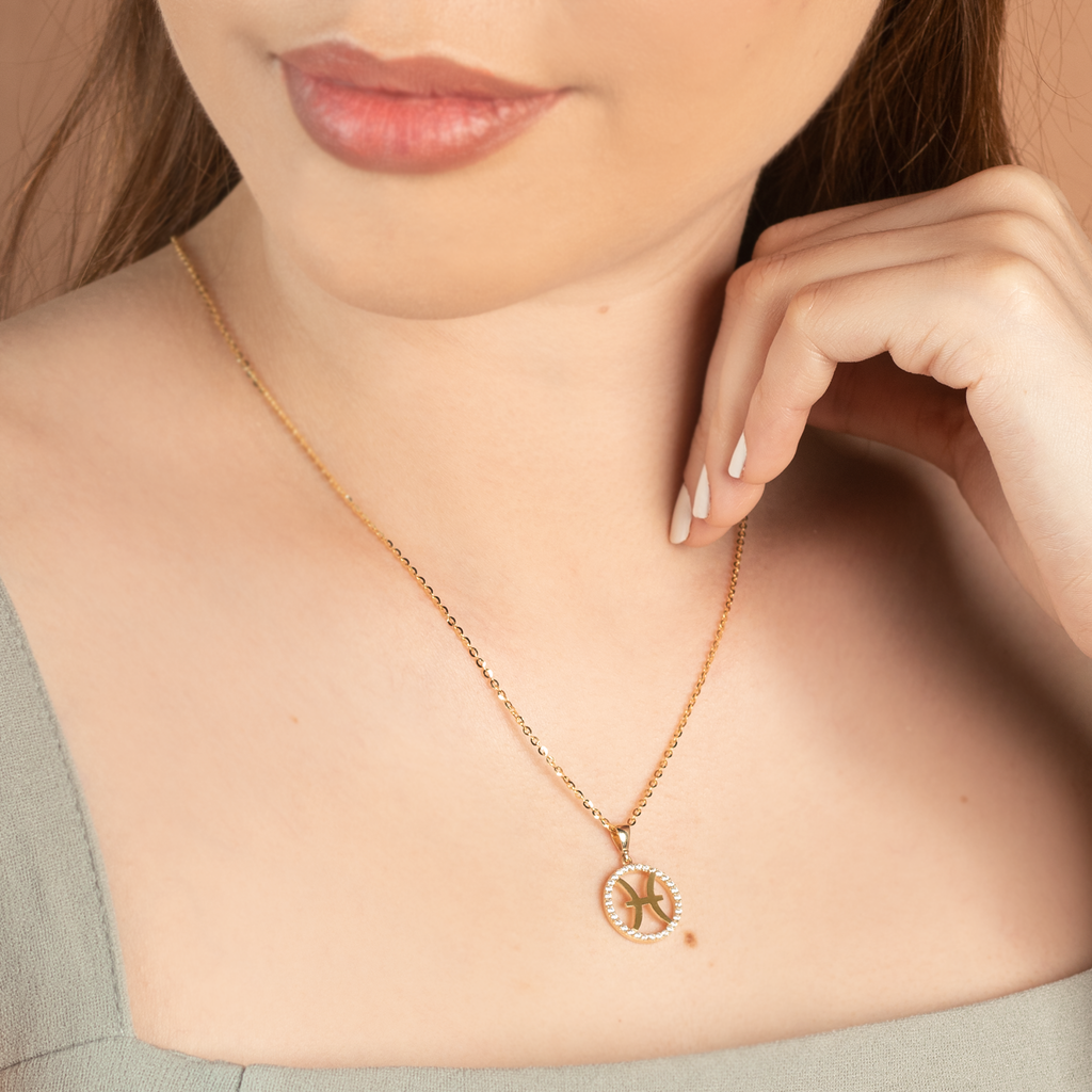 Pisces Pendant 14k gold stacked on model neck – Foundry
