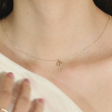 Birthstone Sphere Necklace White Quartz 14k gold stacked on model neck, video – Foundry