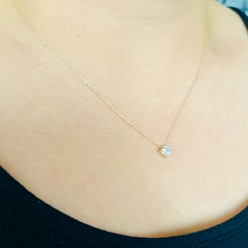 Round Necklace 14k gold stacked on model ears – Foundry