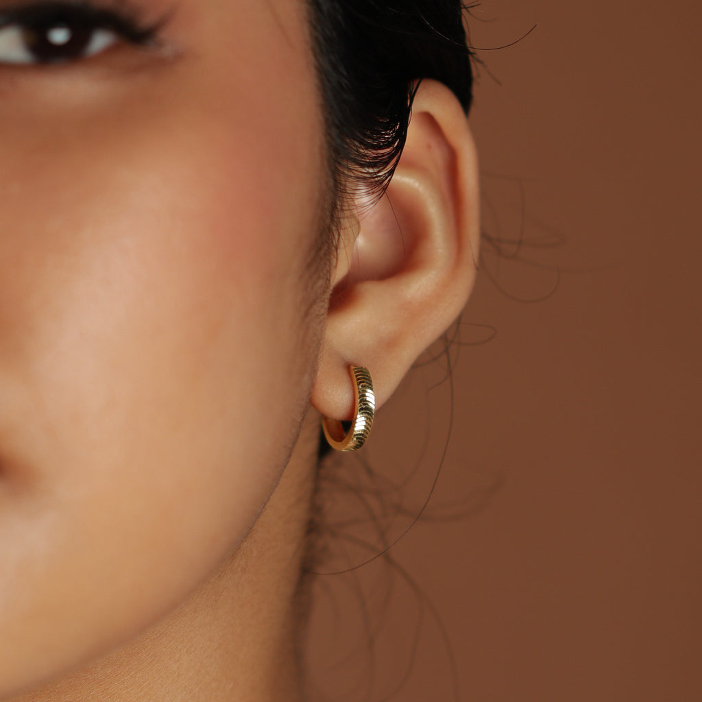 Scalloped Hoops 18k gold stacked on model ear – Foundry