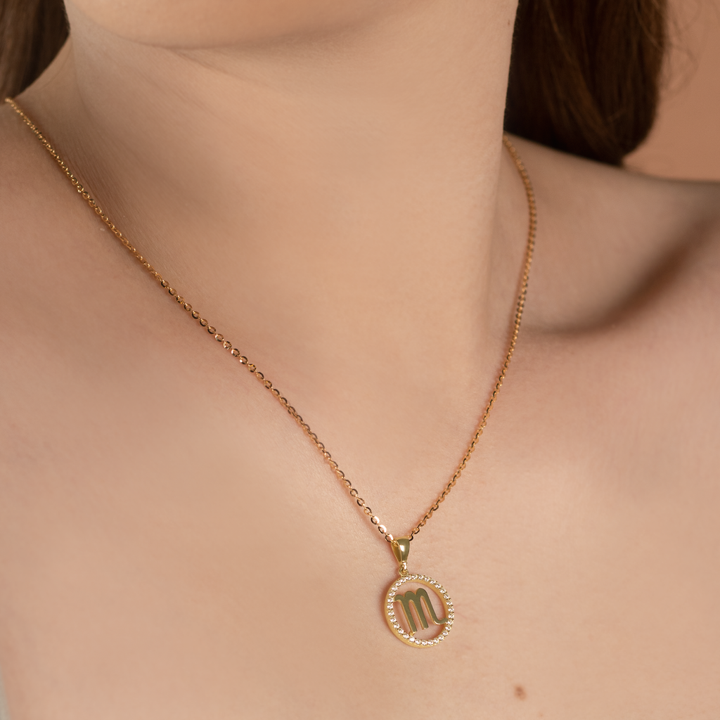 Scorpio Pendant 14k gold stacked on model neck – Foundry