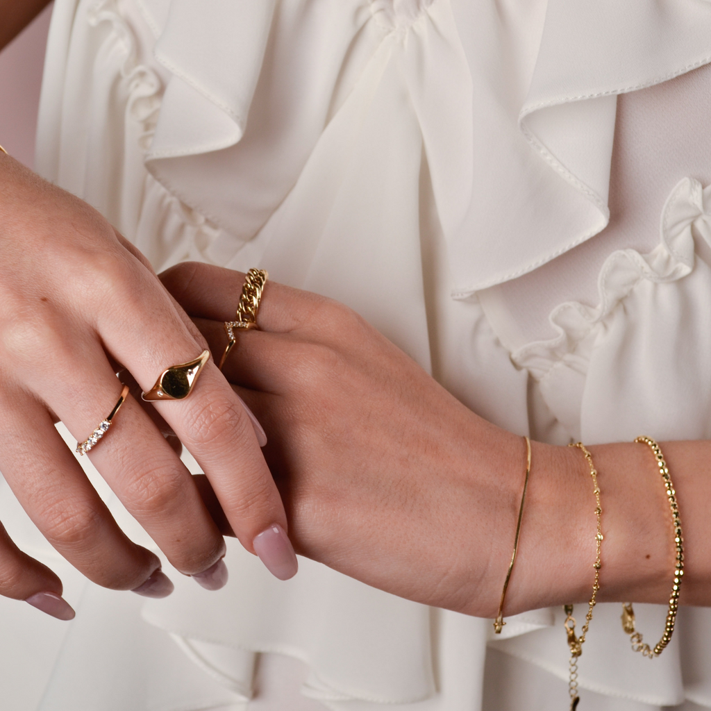 Signet Ring 14k gold stacked on model finger – Foundry