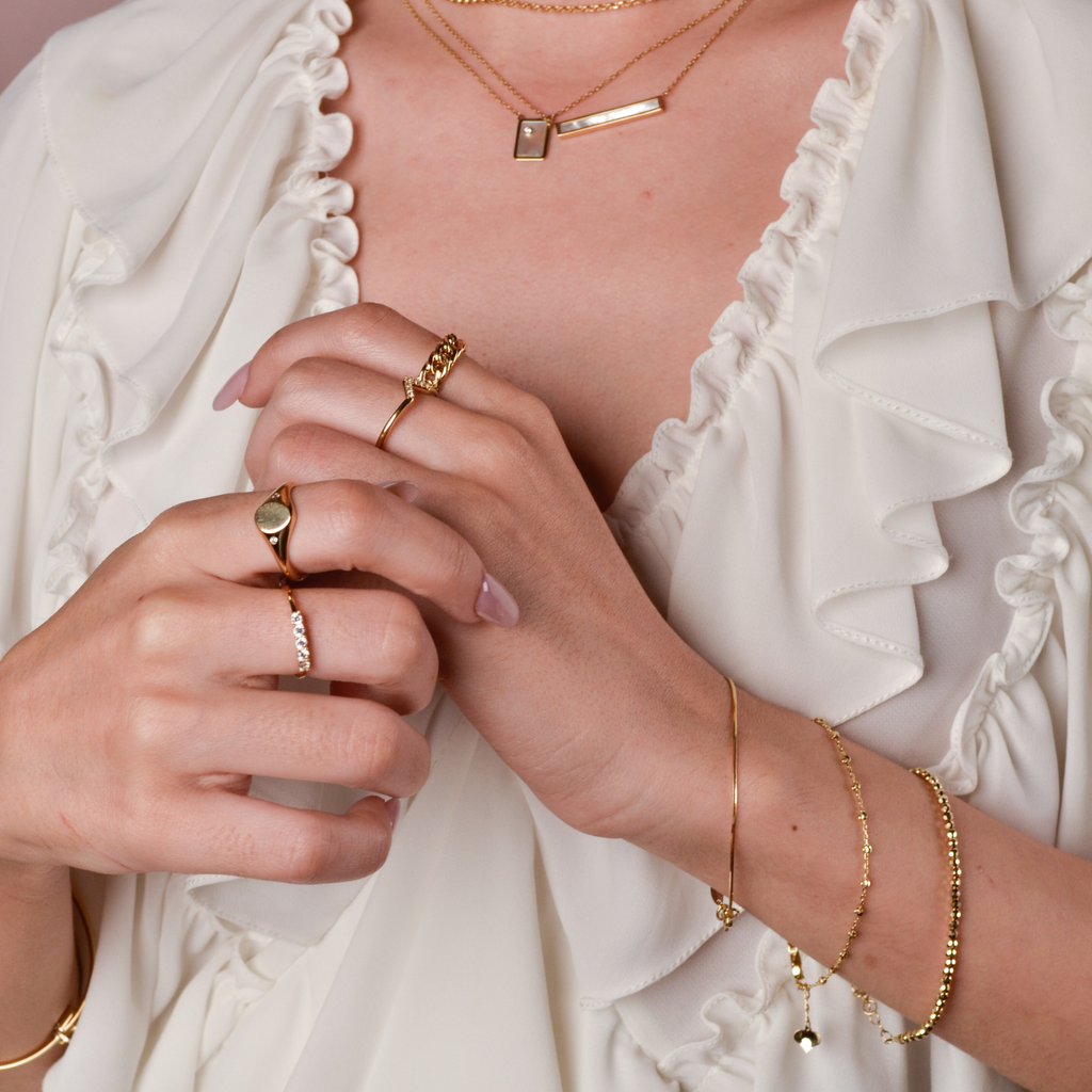 Signet Ring 14k gold stacked on model finger – Foundry