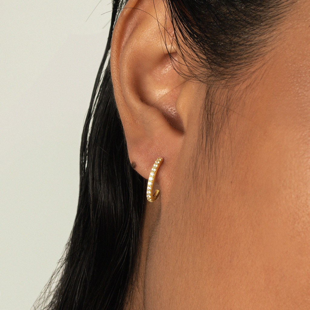 Single Line Mini Hoops 18k gold stacked on model ear – Foundry