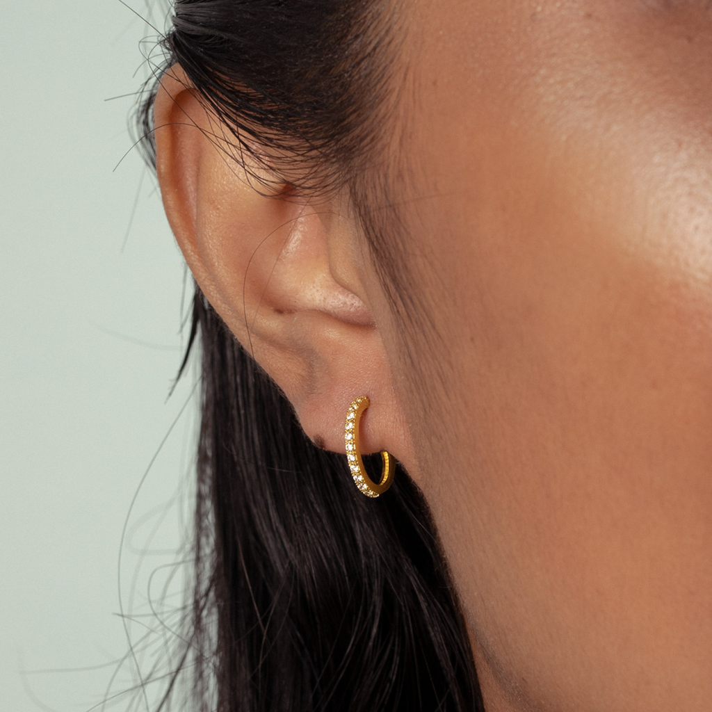 Single Line Mini Hoops 18k gold stacked on model ear – Foundry