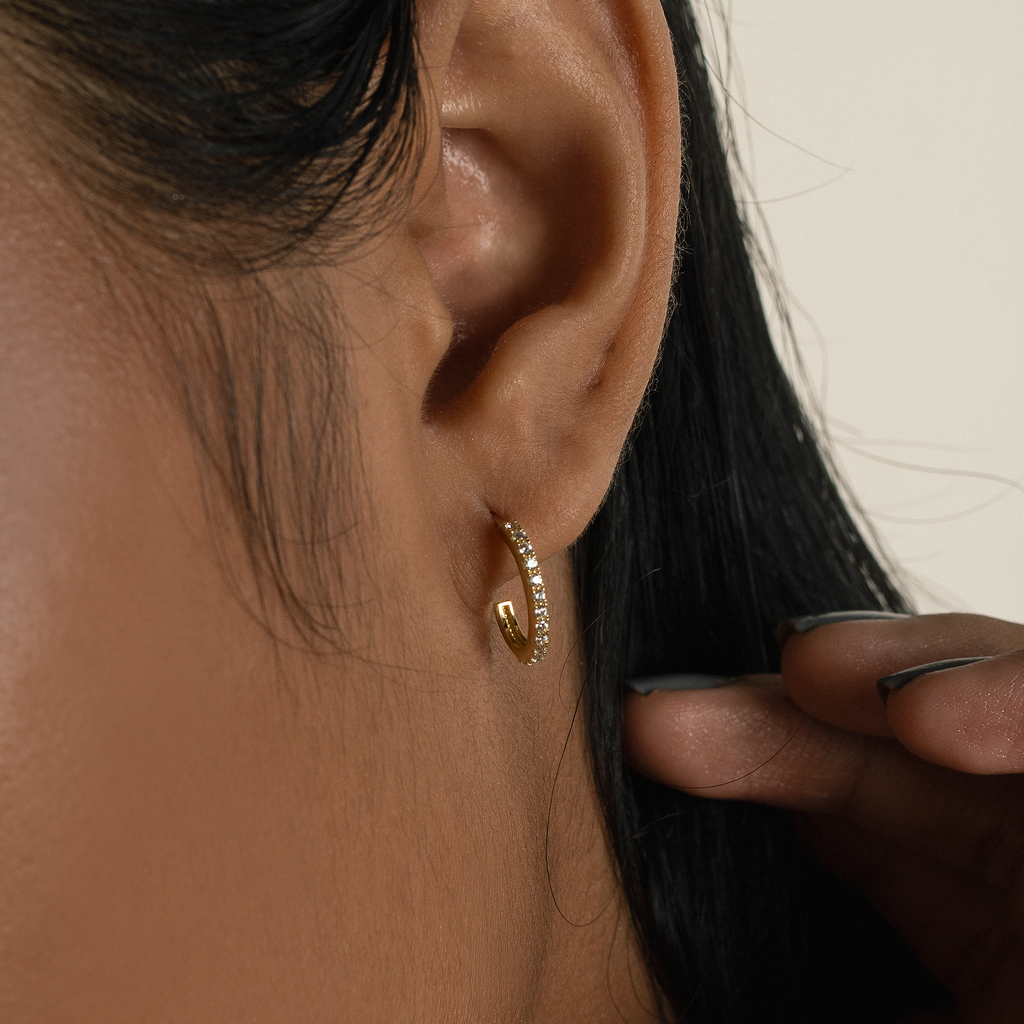 Single Line Mini Hoops 18k gold stacked on model ear – Foundry