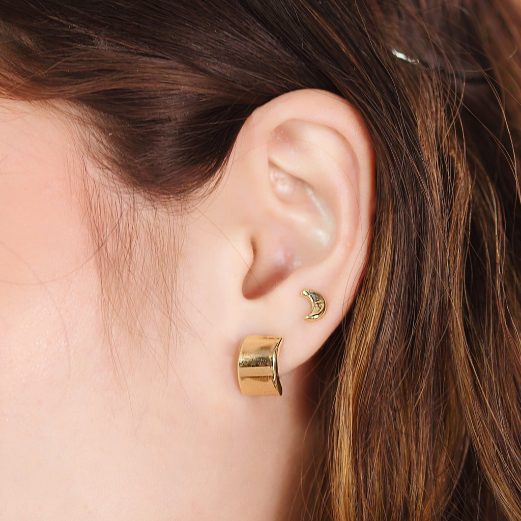 Single Moon Studs 14k gold stacked with model wrist – Foundry