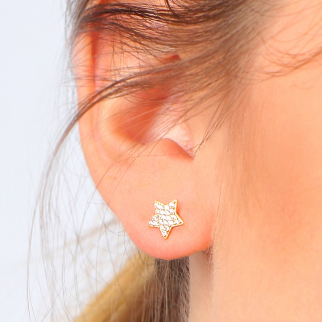 Single Pave Star Stud 18k gold stacked on model ear – Foundry