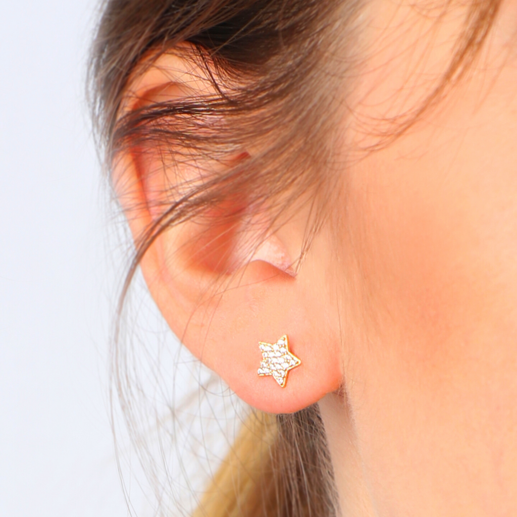 Single Pave Star Stud 18k gold stacked on model ear – Foundry