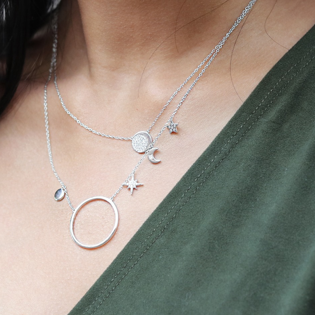 Sky Halo Necklace Sterling Silver stacked on model neck – Foundry