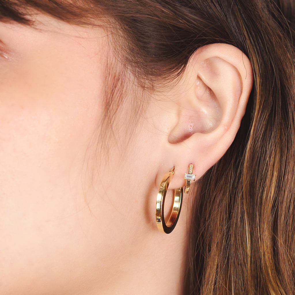 Slim Baguette Hoops 14k gold stacked on model ear – Foundry