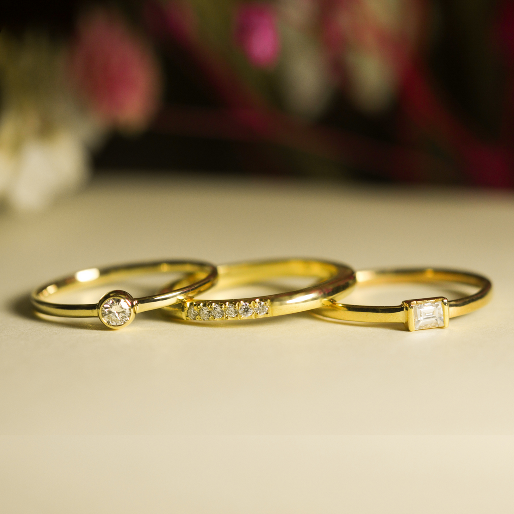 Solo Diamond Ring 14k gold stacked on model finger – Foundry