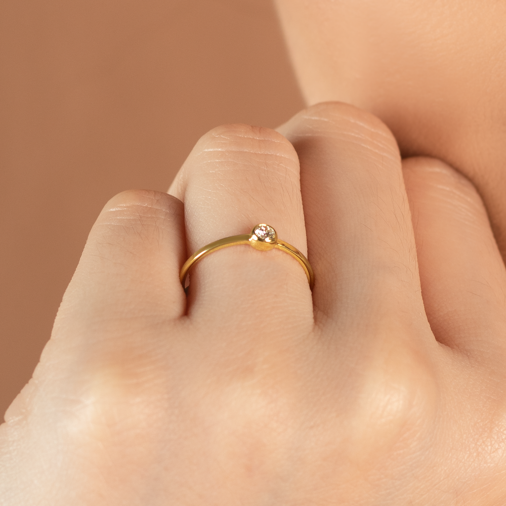 Solo Diamond Ring 14k gold stacked on model finger – Foundry