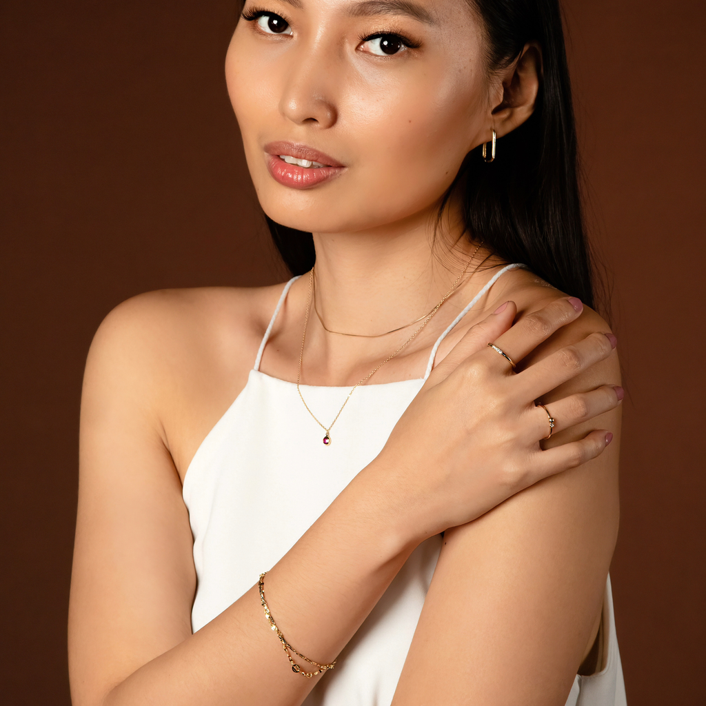 Solo Large U Hoops 14k gold stacked on model ear – Foundry