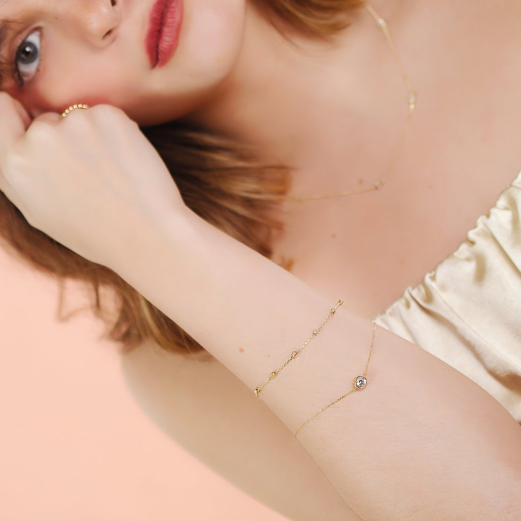 Sphere Chain Bracelet 14k gold stacked on model wrist – Foundry