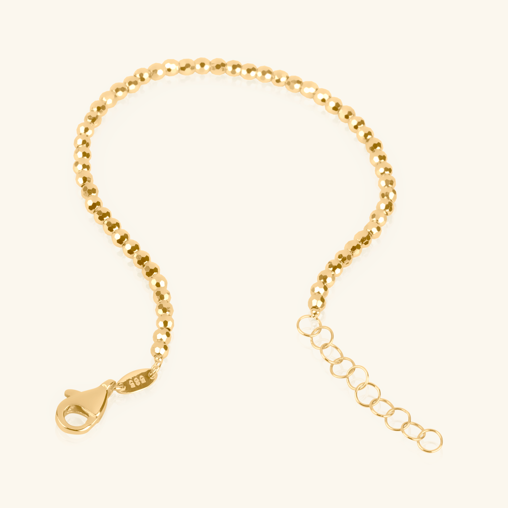 Close-up of lobster clasp on Spheres Bracelet 14k gold – Foundry