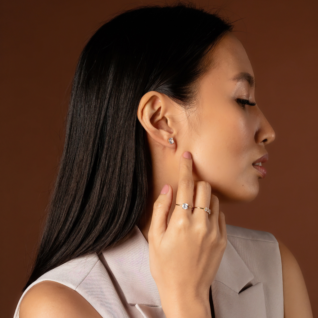 Square Cut Studs 14k gold stacked on model ear – Foundry