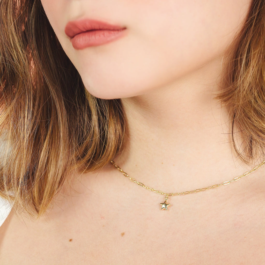 Star Clip Necklace 14k gold stacked on model neck – Foundry