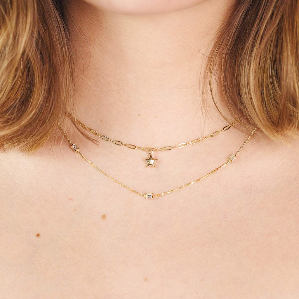 Star Clip Necklace 14k gold stacked on model neck – Foundry