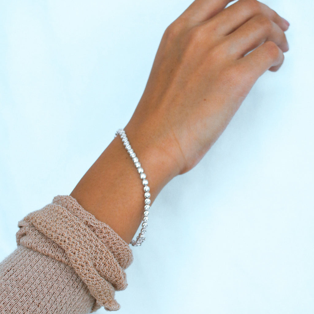 Tennis  Bracelet 18k White Gold stacked on model wrist – Foundry