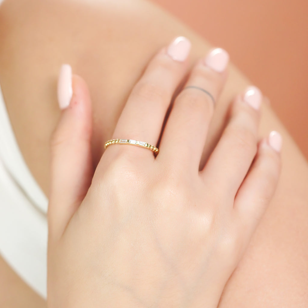 Trio Baguette Beads Ring 14k gold stacked on model wrist – Foundry