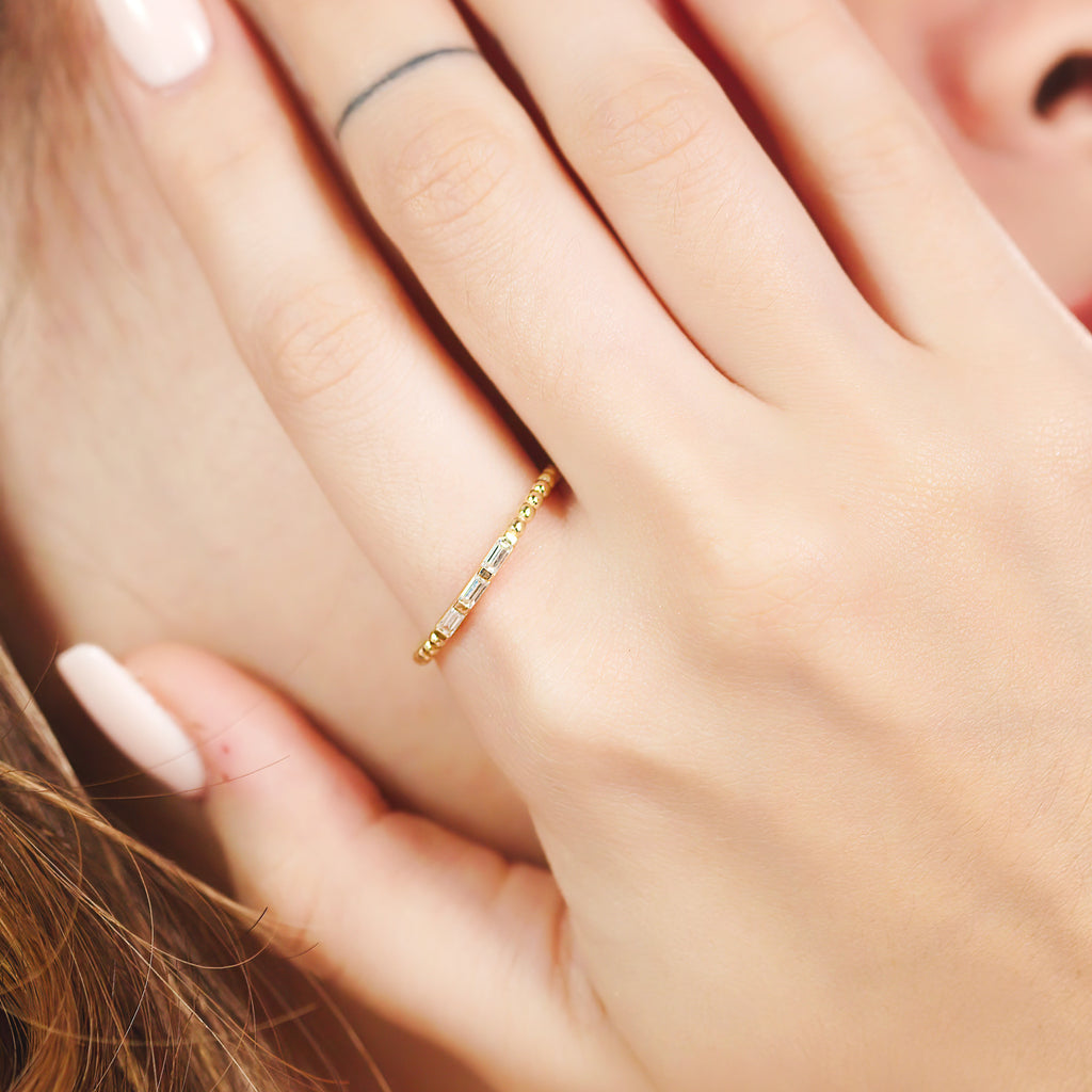 Trio Baguette Beads Ring 14k gold stacked on model wrist – Foundry