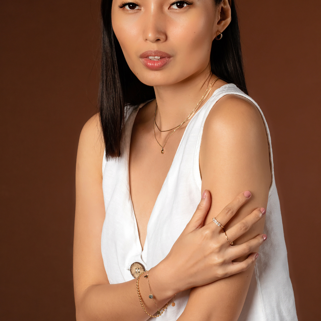 Trio Twin Hoops 14k gold stacked on model ear – Foundry