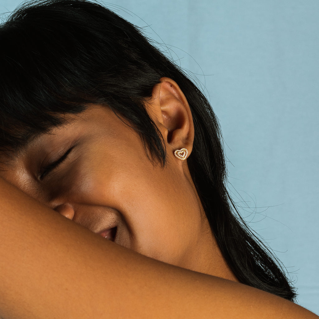 Twin Hearts Pave Studs 14k gold stacked on model ear – Foundry