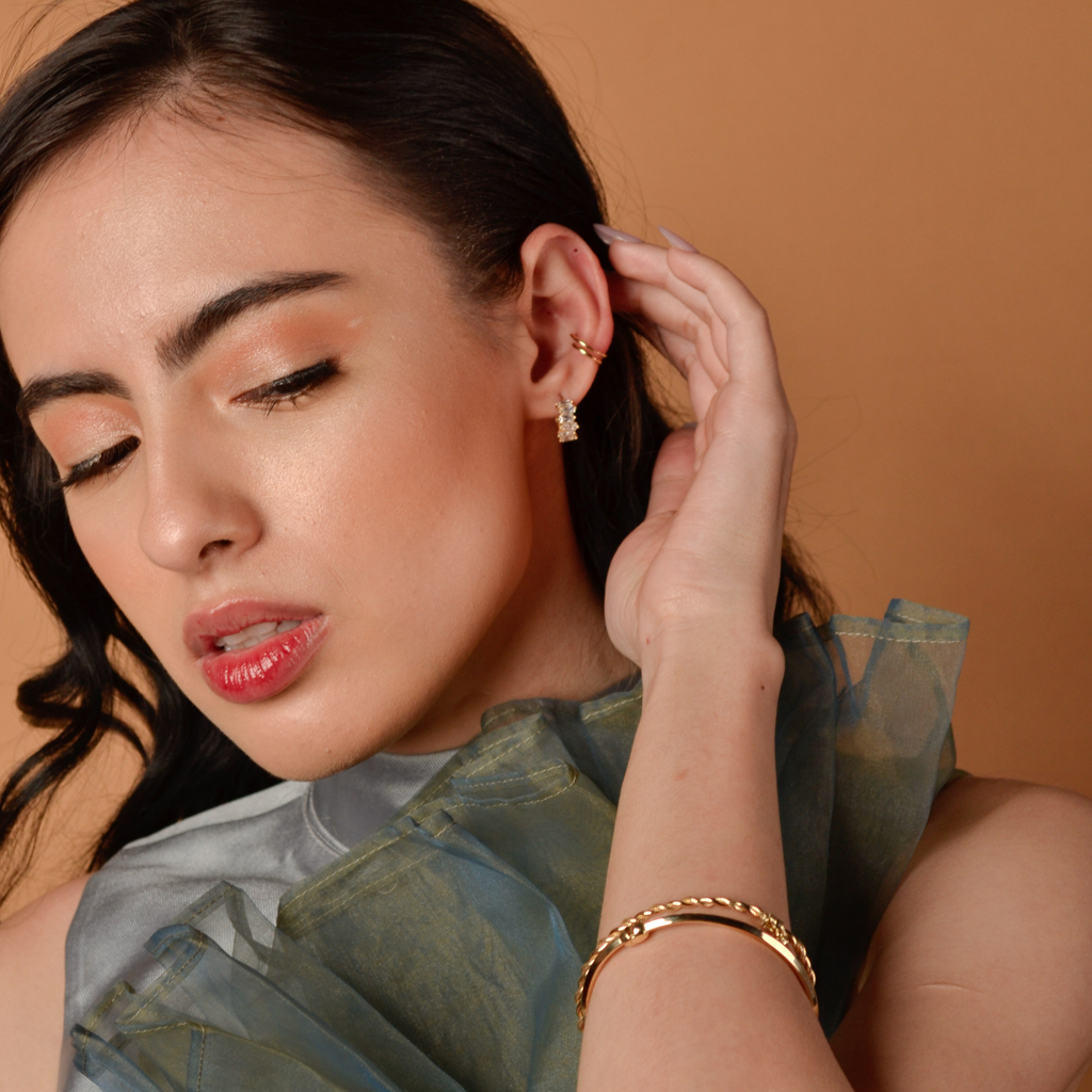 Twin Hoops 14k gold stacked on model ear – Foundry