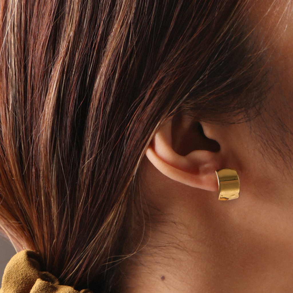 Wide Hoops 14k gold stacked on model ear – Foundry